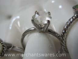 Four Costume Jewelry Rings in assorted sizes