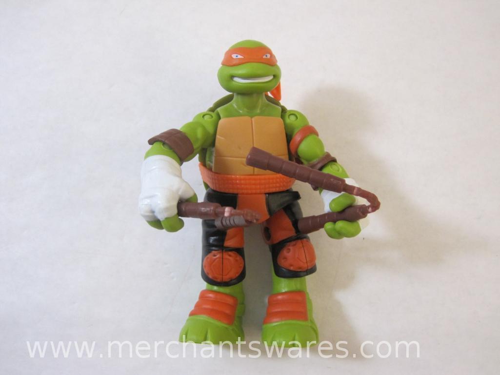 Four Michelangelo Teenage Mutant Ninja Turtles Figures including 2013 Stealth Tech Michelangelo,