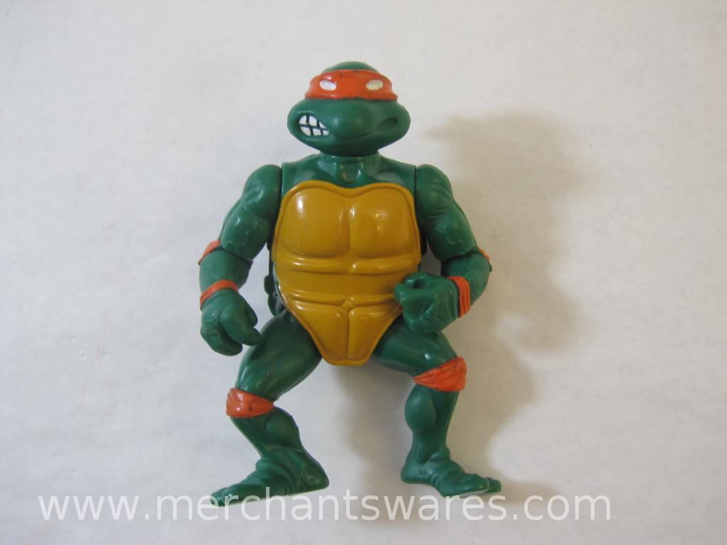 Four Teenage Mutant Ninja Turtles including 2013 Stealth Tech Raphael, 2012 Hand to Hand Ooze