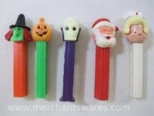 Five Pez Dispensers includes Santa and Nurse, USA no feet, Pumpkin and Witch, Austria no feet, Dr