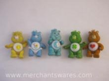 Five Vintage Care Bear Figures including Tenderheart, Funshine, Good Luck, Bedtime and Baby Tugs, 9