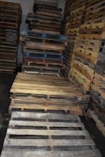 ROW OF (4) COLUMNS OF MISC. SIZE WOODEN PALLETS,