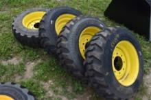 4 Forerunner 10-16.5 skid Steer tires on 8 Lug Rims