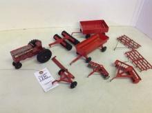selection of red farm implements & tractor