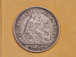 1865 Peru silver 1/5 sol in About Uncirculated