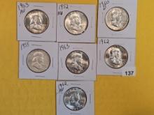 Seven purty AU-BU silver Franklin Half Dollars