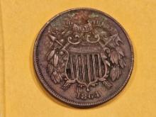1864 Two Cent piece in About Uncirculated