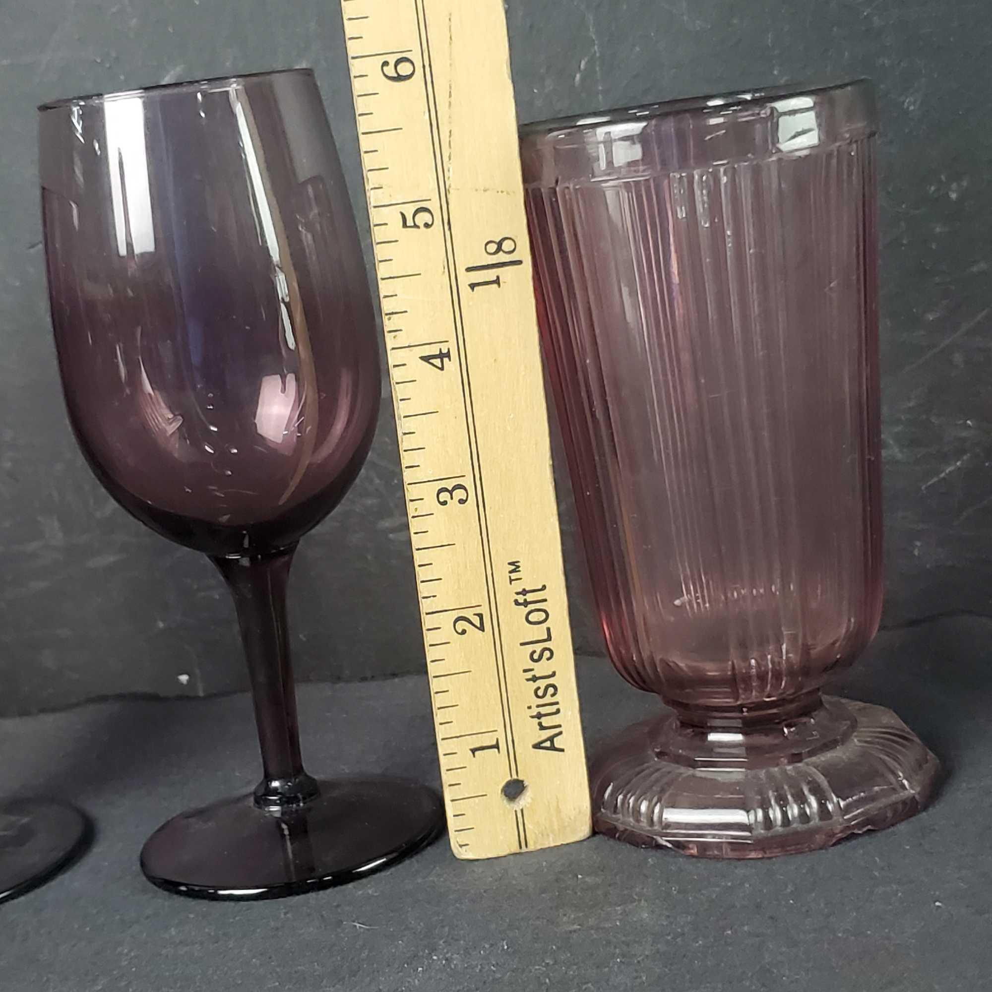 Bin of various colered glassware