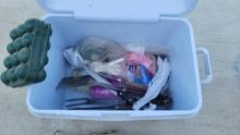 rubbermaid cooler with assorted camp supplies