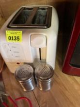Toaster and salt and pepper shakers that are metal