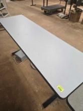 Adjustable Height, 45 Inch Long, 11 Inch Wide Table.