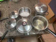 assortment of pots with attachments and lids