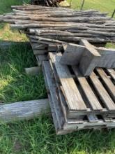 Bundle of wooden cedar fence stays, a couple pallets