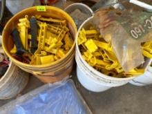 2 Buckets of electric fence insulators
