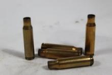Three Winchester boxes of fired 308 brass. Two are vintage boxes. Count 60.