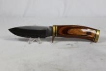 Buck U.S.A. Model 192C. 4 inch blade, brass hilt and pommel with laminated wood handle. Original