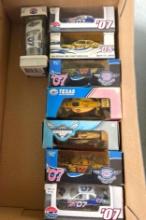 Box of Texas Motor Speedway Diecast Replica Cars and Hot Wheels Mystery Car