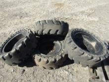 (4) SKID STEER SOLID NOFLAT TIRES AND RIMS