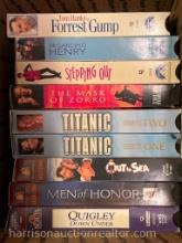assortment of VHS tapes.
