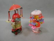 Pair Celluloid & Tin Litho Wind Up Merry-Go-Rounds