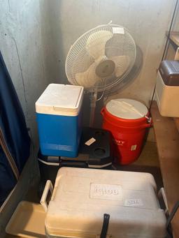 coolers and house fan in basement
