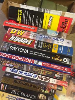 NASCAR books and movies in basement