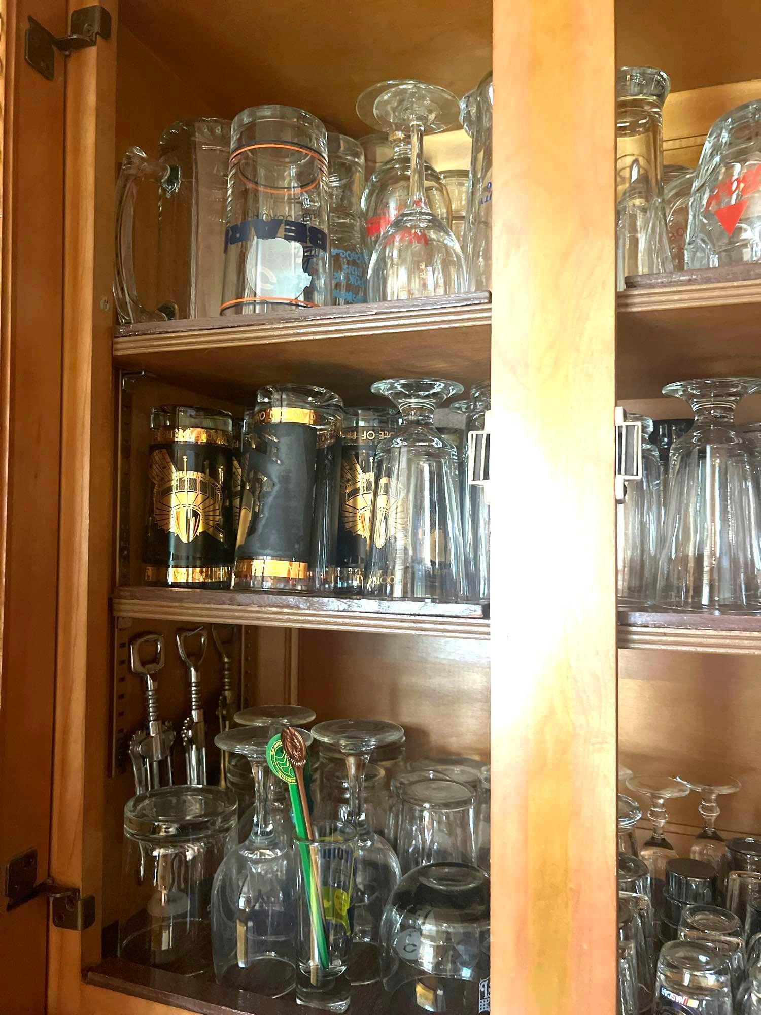 cabinet of beer glasses shot glasses, and more kitchen