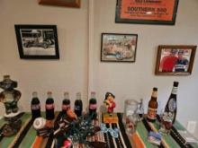 What's sorted collectibles on table including Coca-Cola.