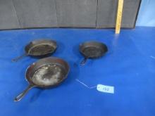 CAST IRON FRYING PANS - ONE LODGE AND OTHERS UNMARKED