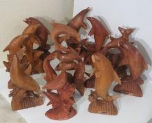 Assorted box of damaged wood dolphin carvings