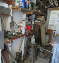 mixed contents of rear storage room includes large metal storage cabinet, pipe threader, space he...