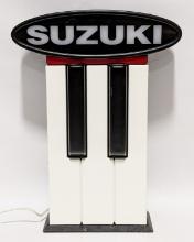 Suzuki Piano's Lighted Advertising Sign