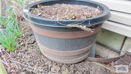 Plastic planter with potting soil. Must take contents