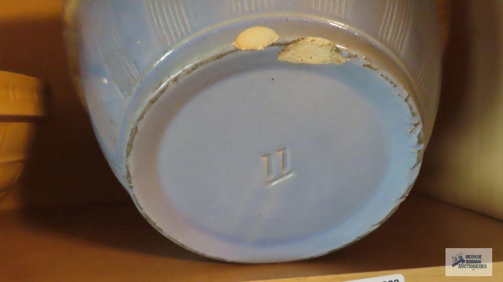 Pottery bowl with stars and moon on side and number 11 on the bottom. Chips on bottom.
