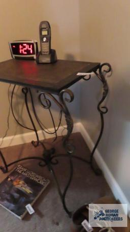 Decorative table with ornate metal legs