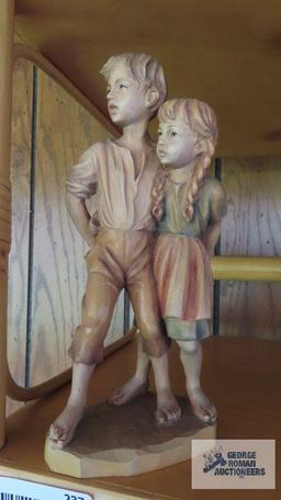 boy and girl wood carved figurine