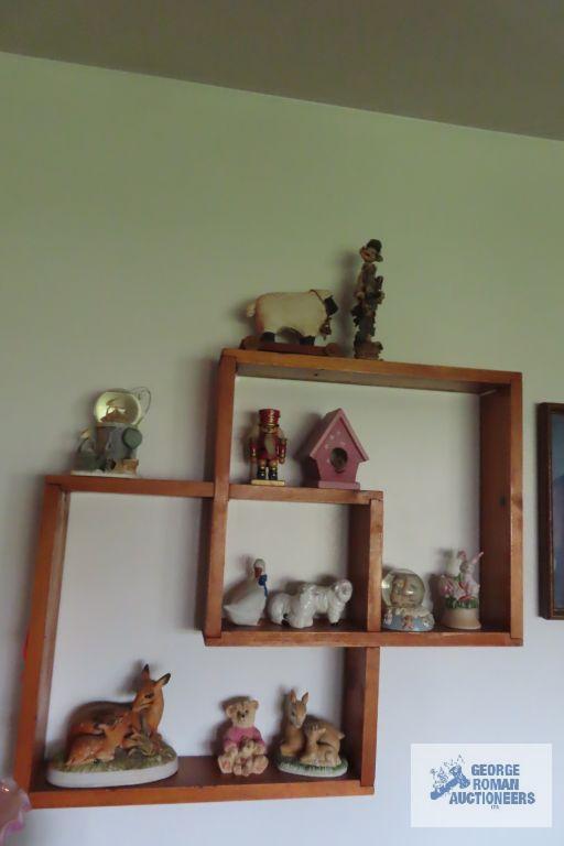 wood knick knack shelf with assorted knick knacks