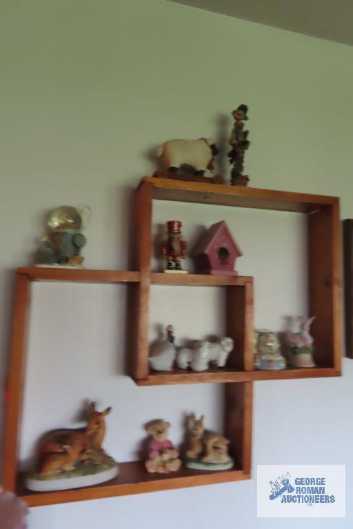 wood knick knack shelf with assorted knick knacks