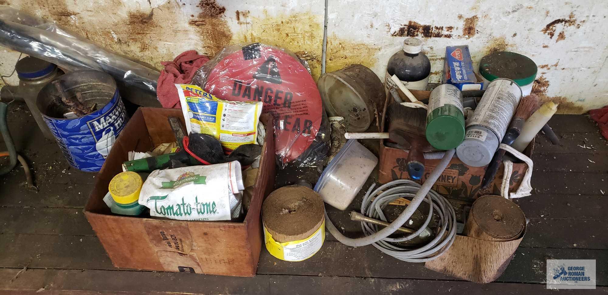 Lot of wire, sprays, hardware, electric motor and etc on top and under bench