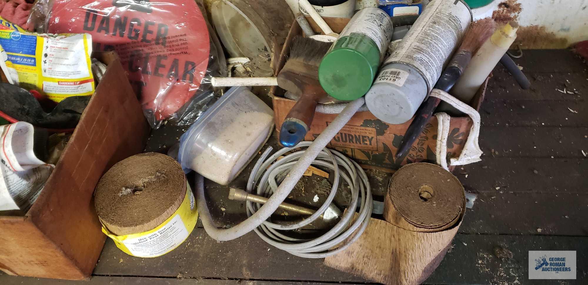 Lot of wire, sprays, hardware, electric motor and etc on top and under bench
