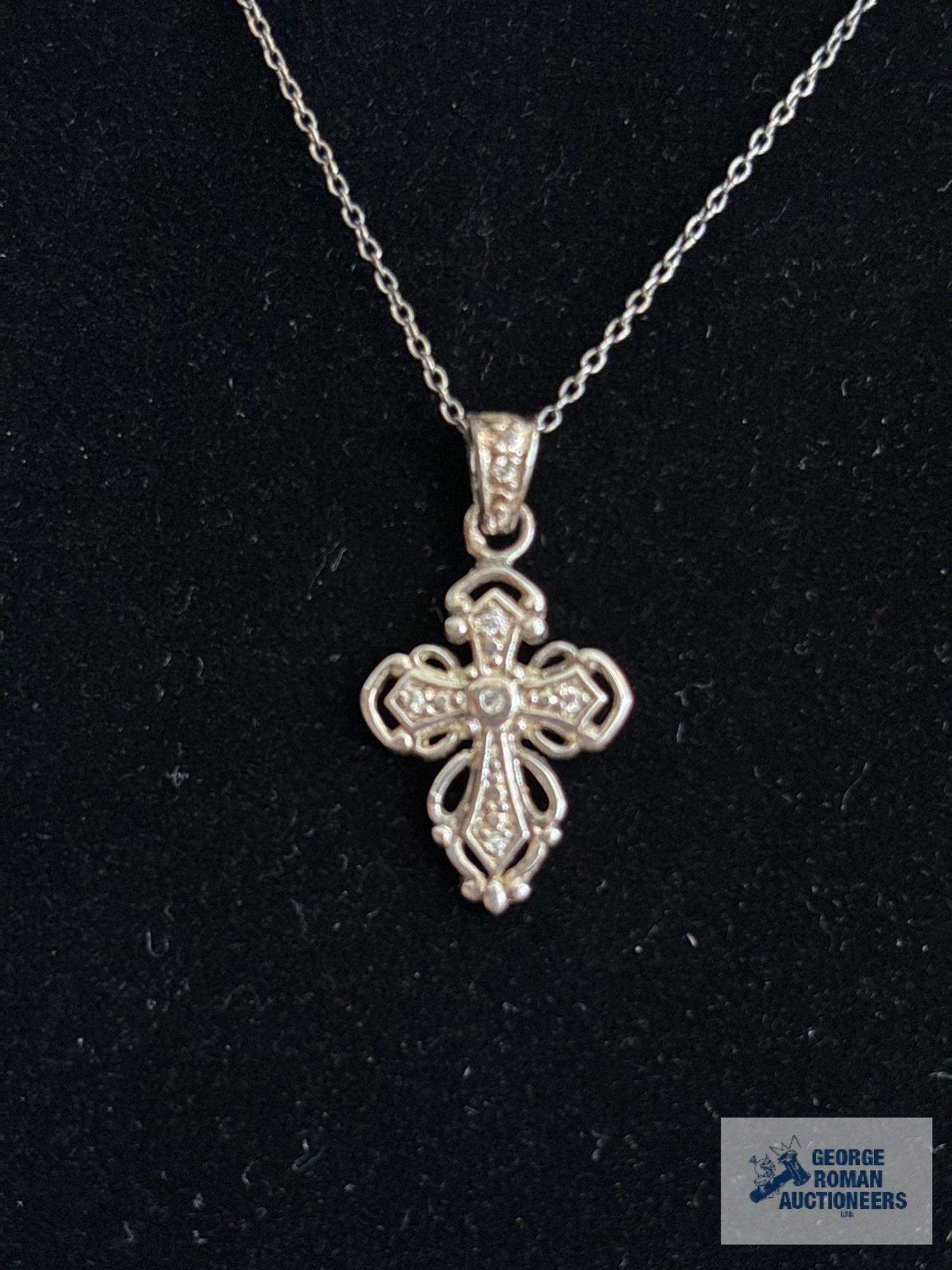 Silver colored cross pendant with clear gemstone chips, marked 925, on silver colored chain, marked