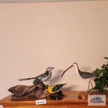 Two wooden bird figurines