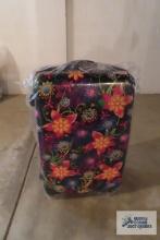 Floral suitcase, looks like it's new in the bag
