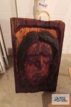 Man carved in wood wall hanging