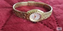 Helbros...ladies gold colored watch (Description provided by seller)