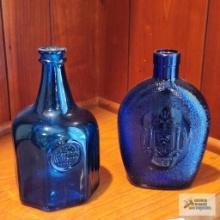 Two blue decorative bottles