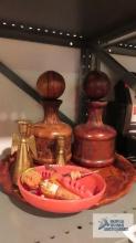 Wood tray, ashtrays, bottle tops, brass candle holders, and leather like decanters