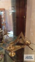 Brass grasshopper and genie lamp