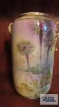 Nippon hand painted vase with double handle. Has hole in center of bottom.