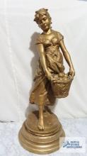 Girl with basket of apple metal bronze colored sculpture. Approximately 31-1/2 in. tall.